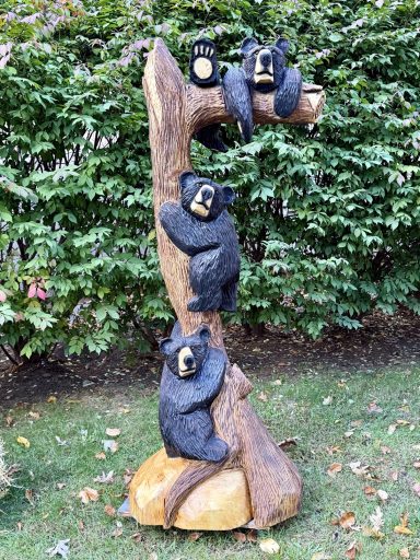 Three black bears in a tree, signature piece, 6 feet tall